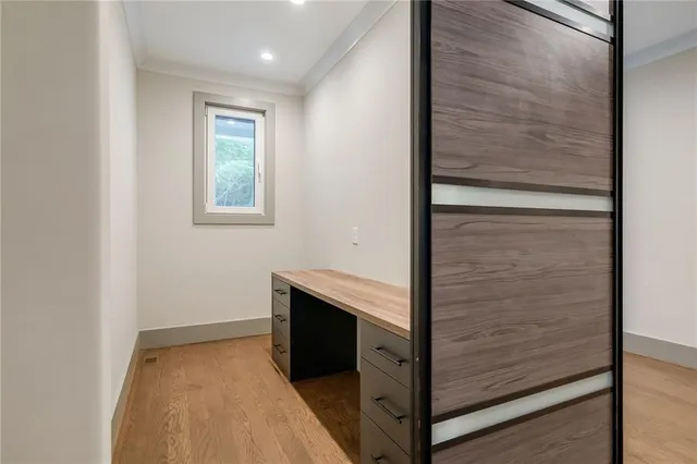 a view of a brick house with a large window