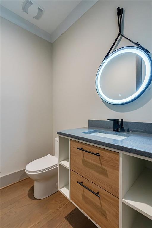 71 Ramey Road Sugar Hill, GA 30518 - Photo 31 of 58 a bathroom with a toilet and a sink