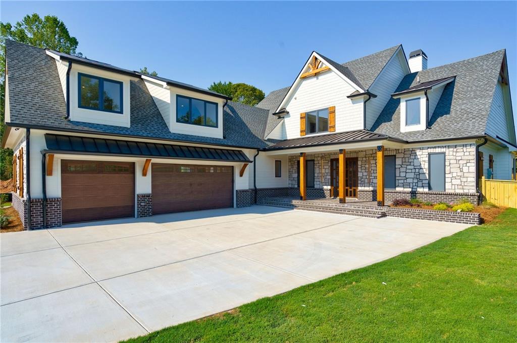 71 Ramey Road Sugar Hill, GA 30518 - Photo 34 of 58 a front view of a house with yard and green space