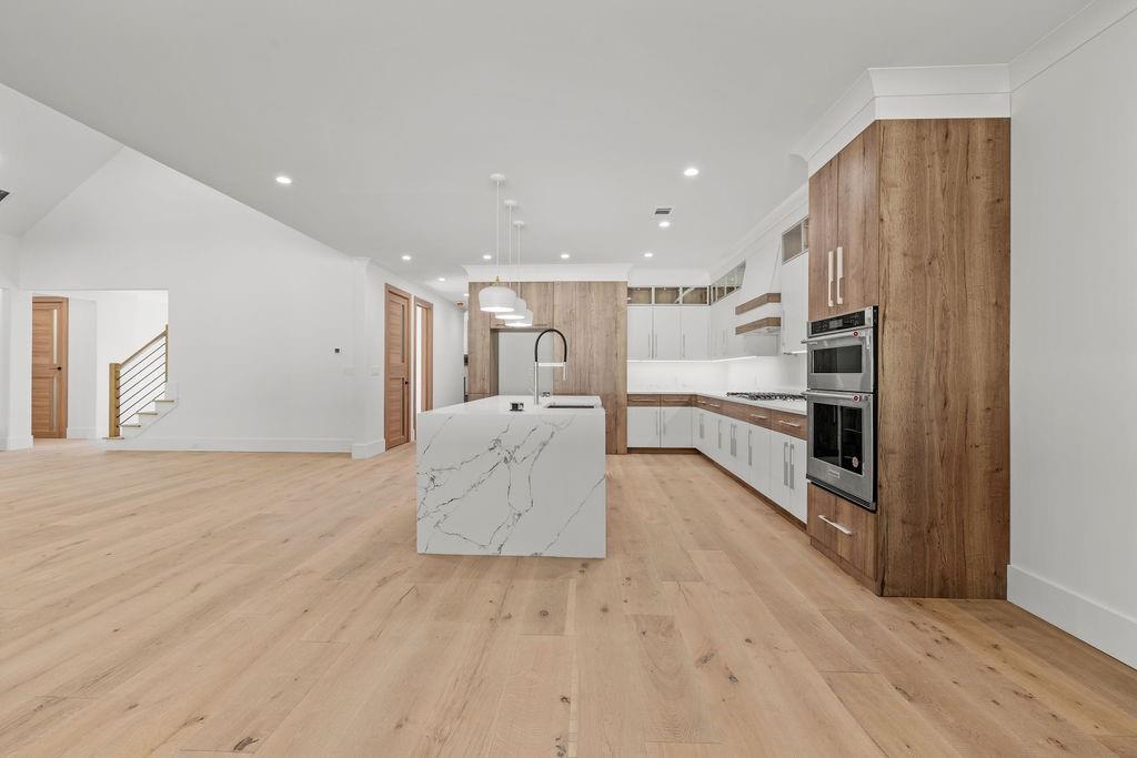 71 Ramey Road Sugar Hill, GA 30518 - Photo 46 of 58 a large white kitchen with stainless steel appliances