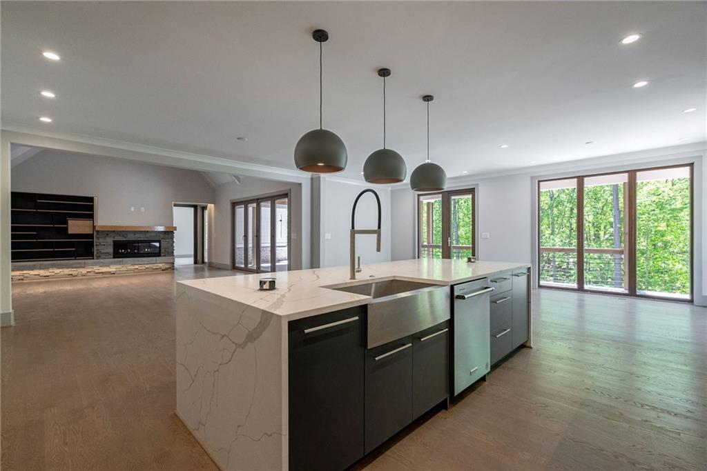 71 Ramey Road Sugar Hill, GA 30518 - Photo 5 of 58 a kitchen with stainless steel appliances granite countertop a sink and stove