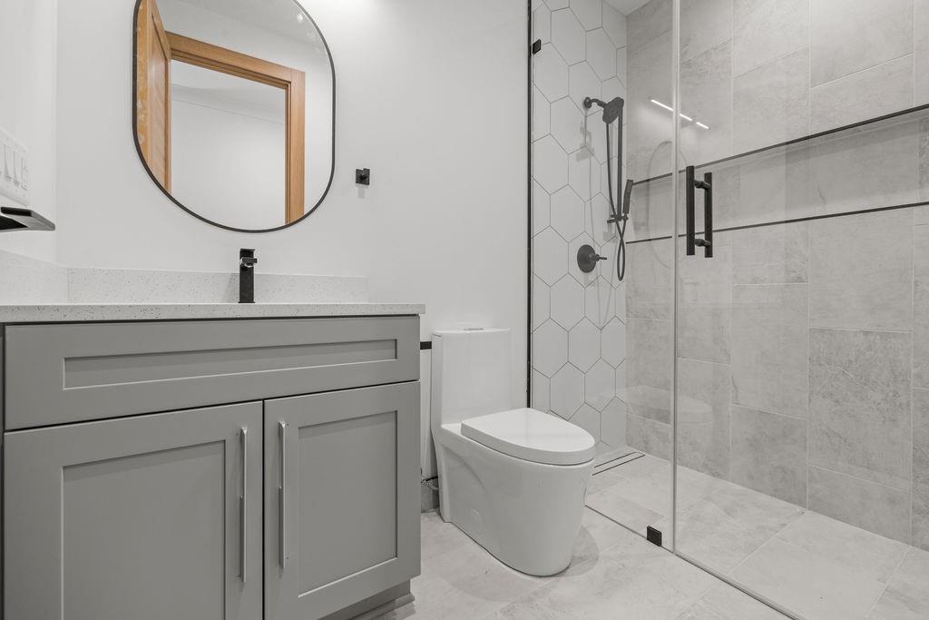 71 Ramey Road Sugar Hill, GA 30518 - Photo 53 of 58 a bathroom with a sink toilet and shower