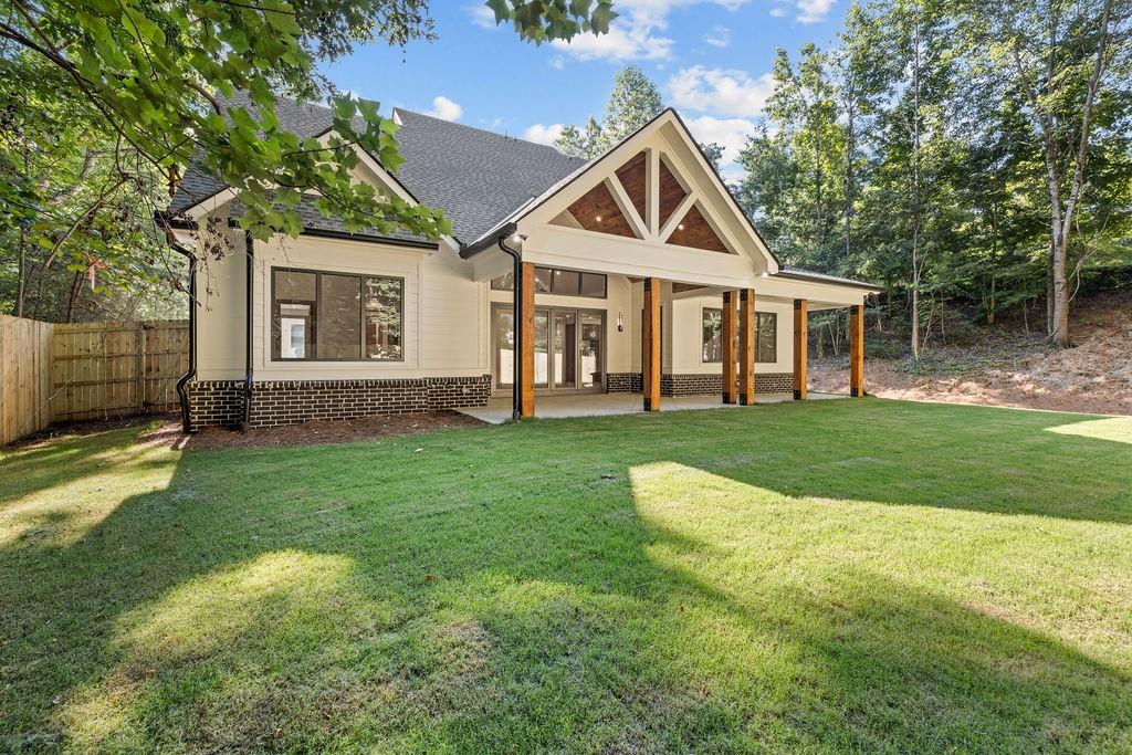 71 Ramey Road Sugar Hill, GA 30518 - Photo 55 of 58 a front view of a house with a yard