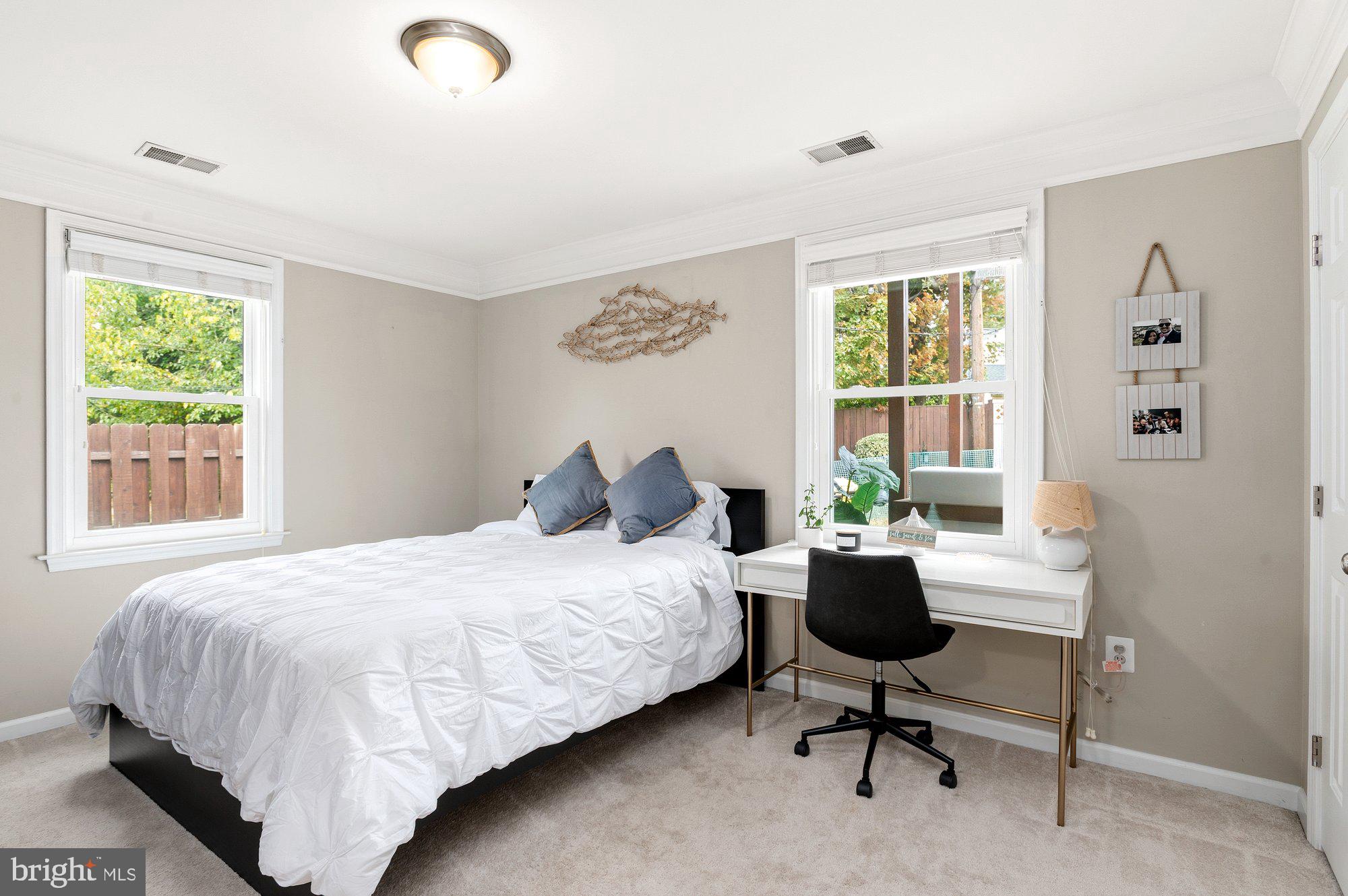 6809 Duke Drive Alexandria, VA 22307 - Photo 14 of 30 a bedroom with a bed and a window