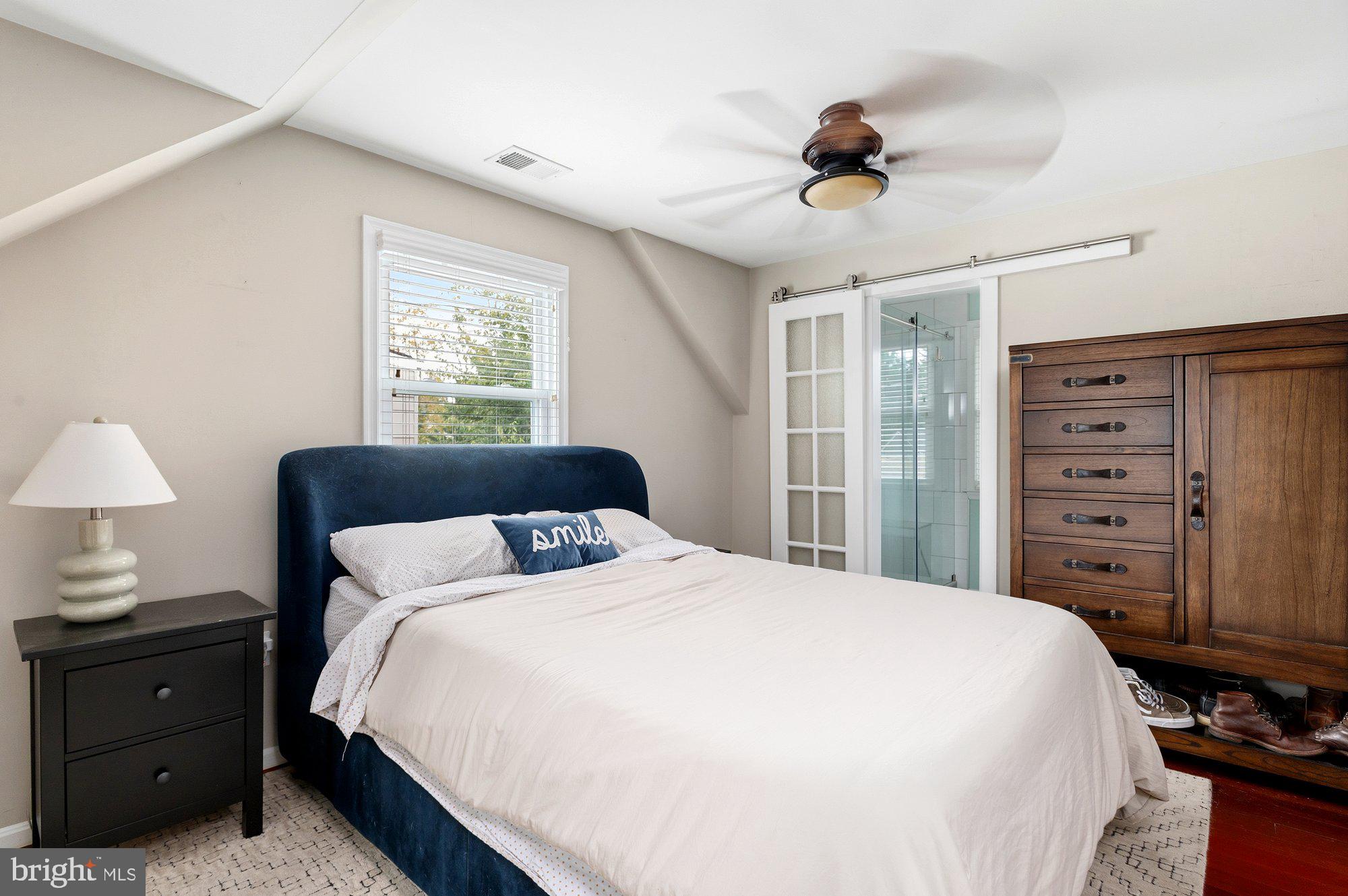 6809 Duke Drive Alexandria, VA 22307 - Photo 17 of 30 a bedroom with a bed and a chandelier