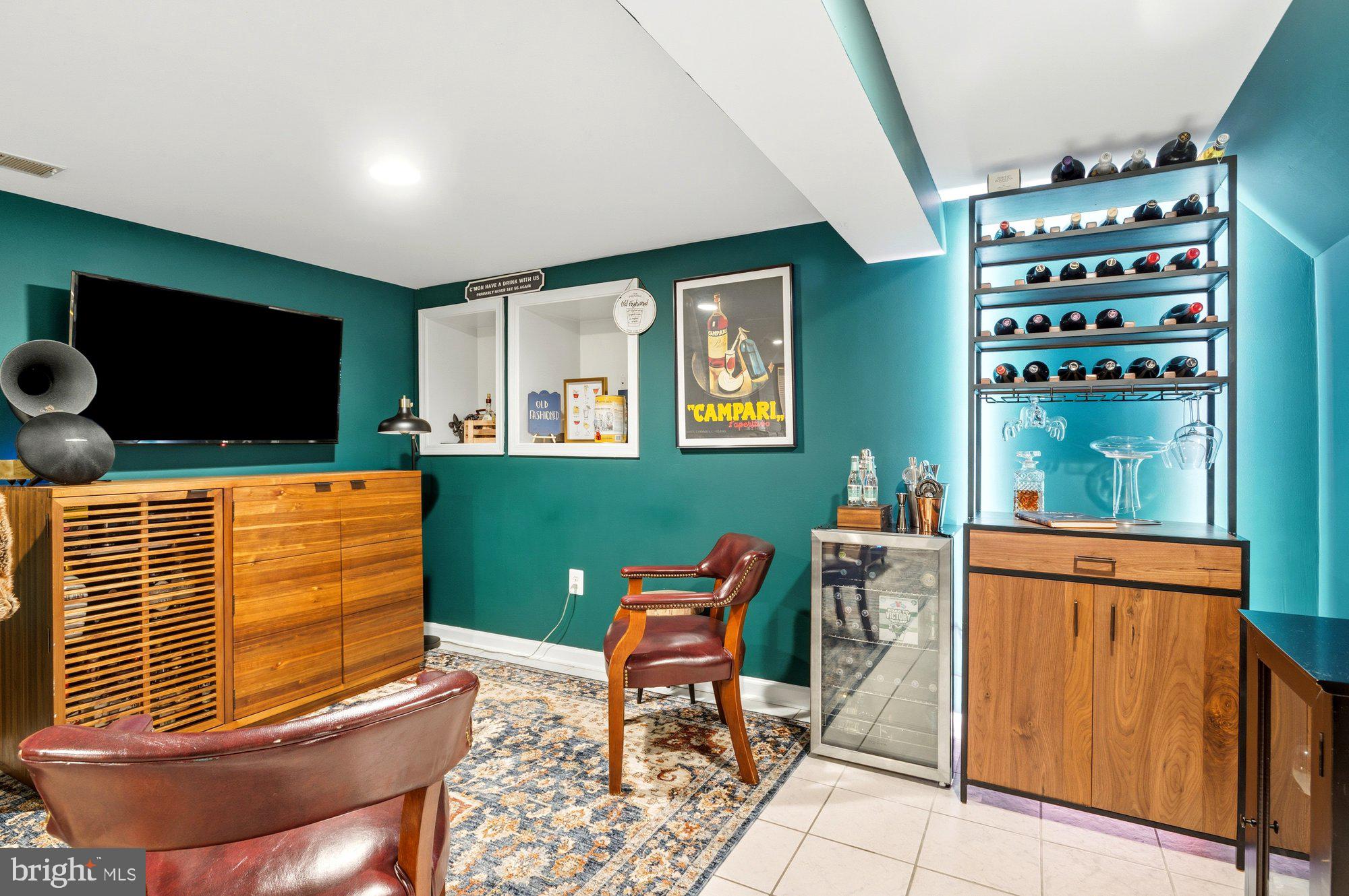 6809 Duke Drive Alexandria, VA 22307 - Photo 23 of 30 a living room with furniture and a flat screen tv