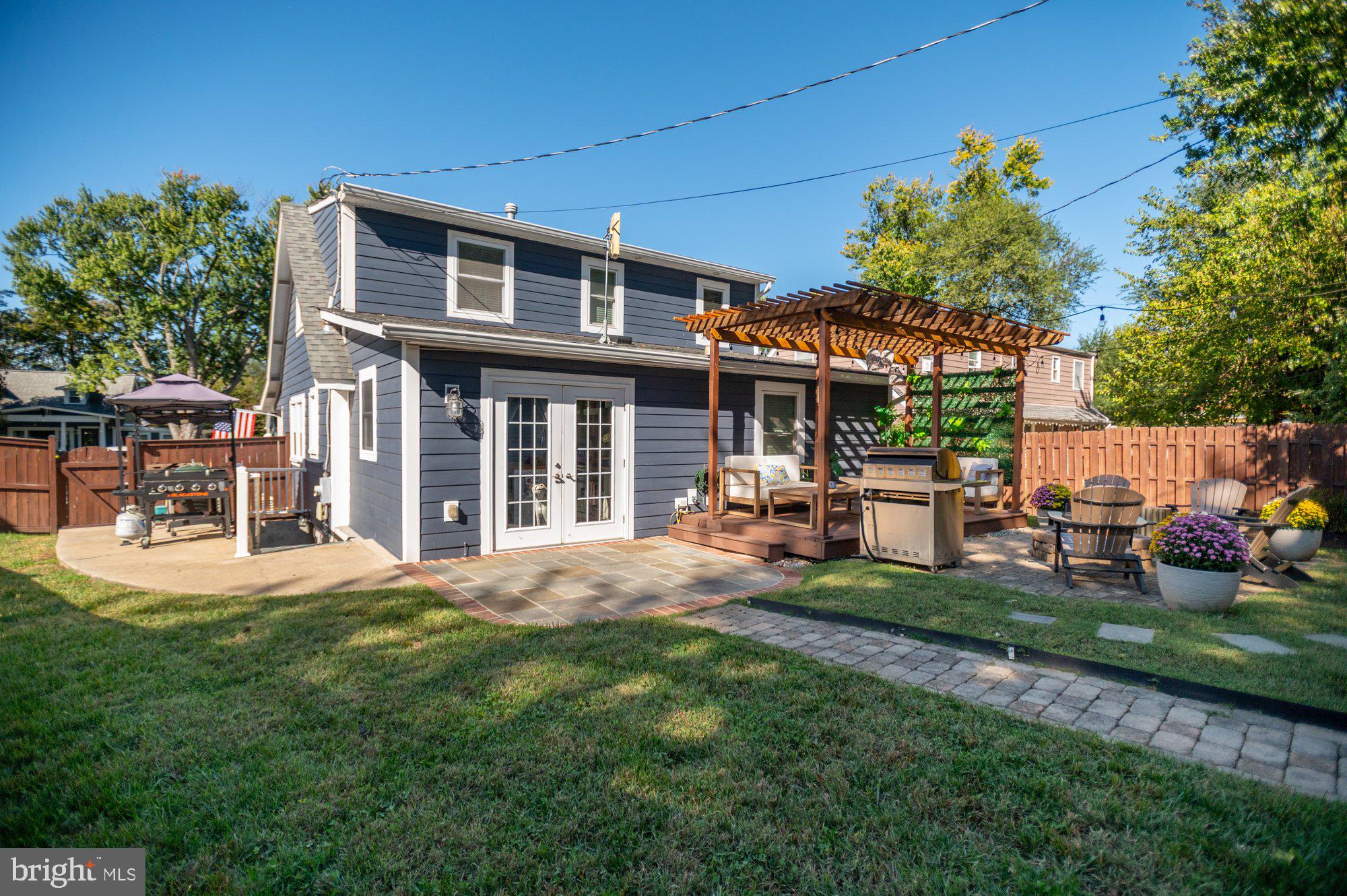 6809 Duke Drive Alexandria, VA 22307 - Photo 26 of 30 a view of a house with backyard porch and sitting area