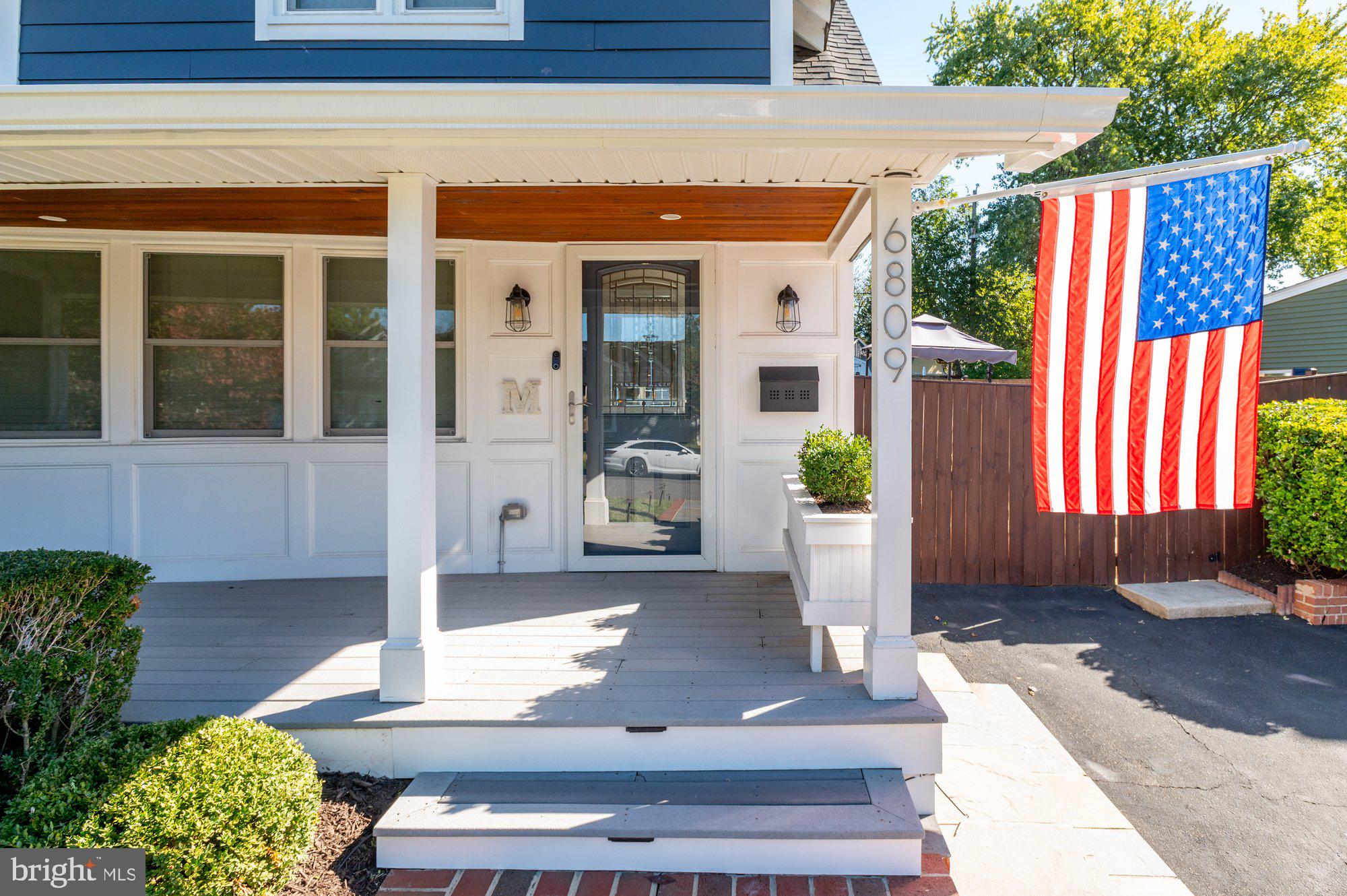 6809 Duke Drive Alexandria, VA 22307 - Photo 3 of 30 a front view of a house with a porch