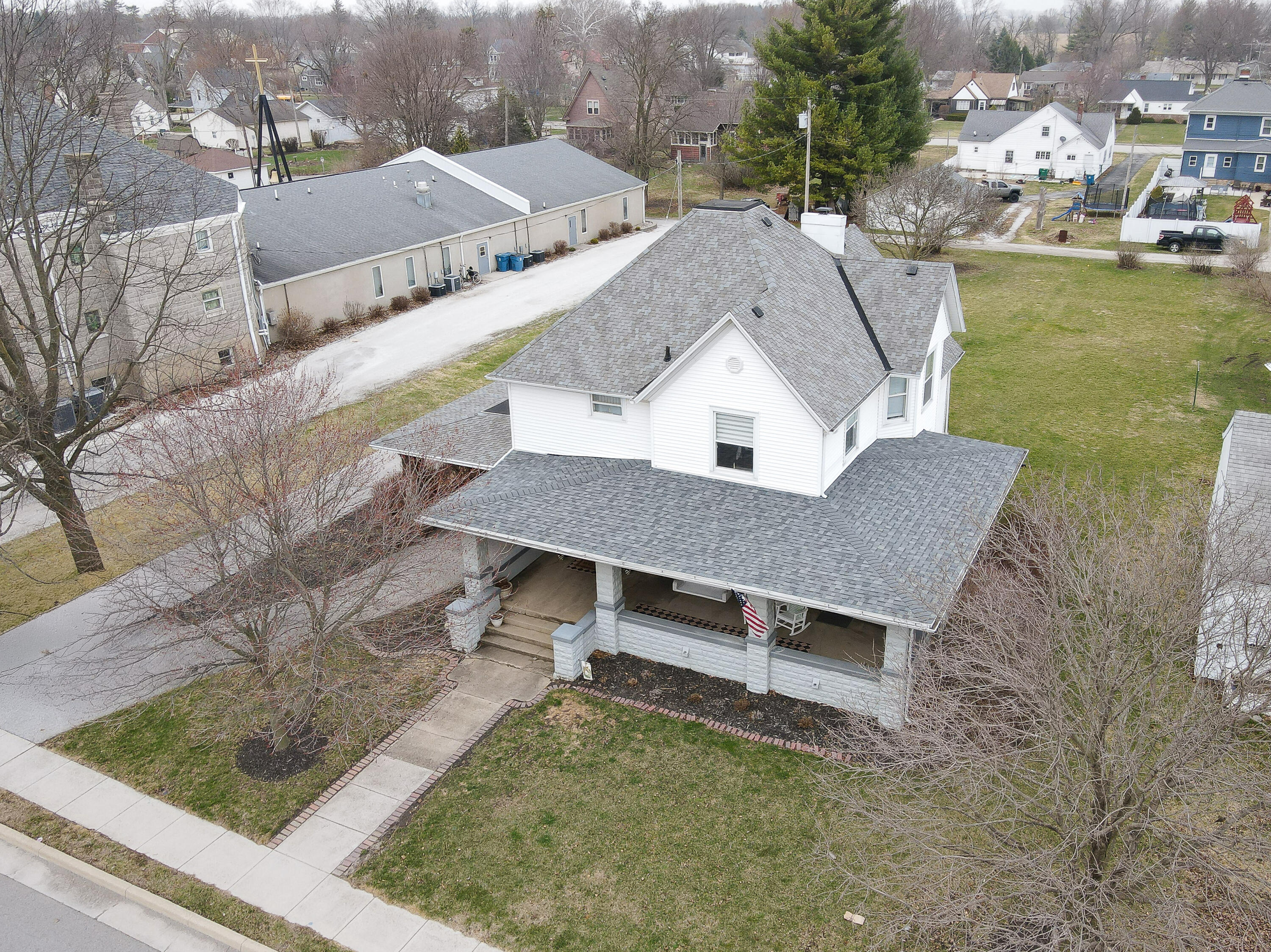 128 East Main Street Brook, IN 47922 - Photo 16 of 68 a view of a house with pool and yard