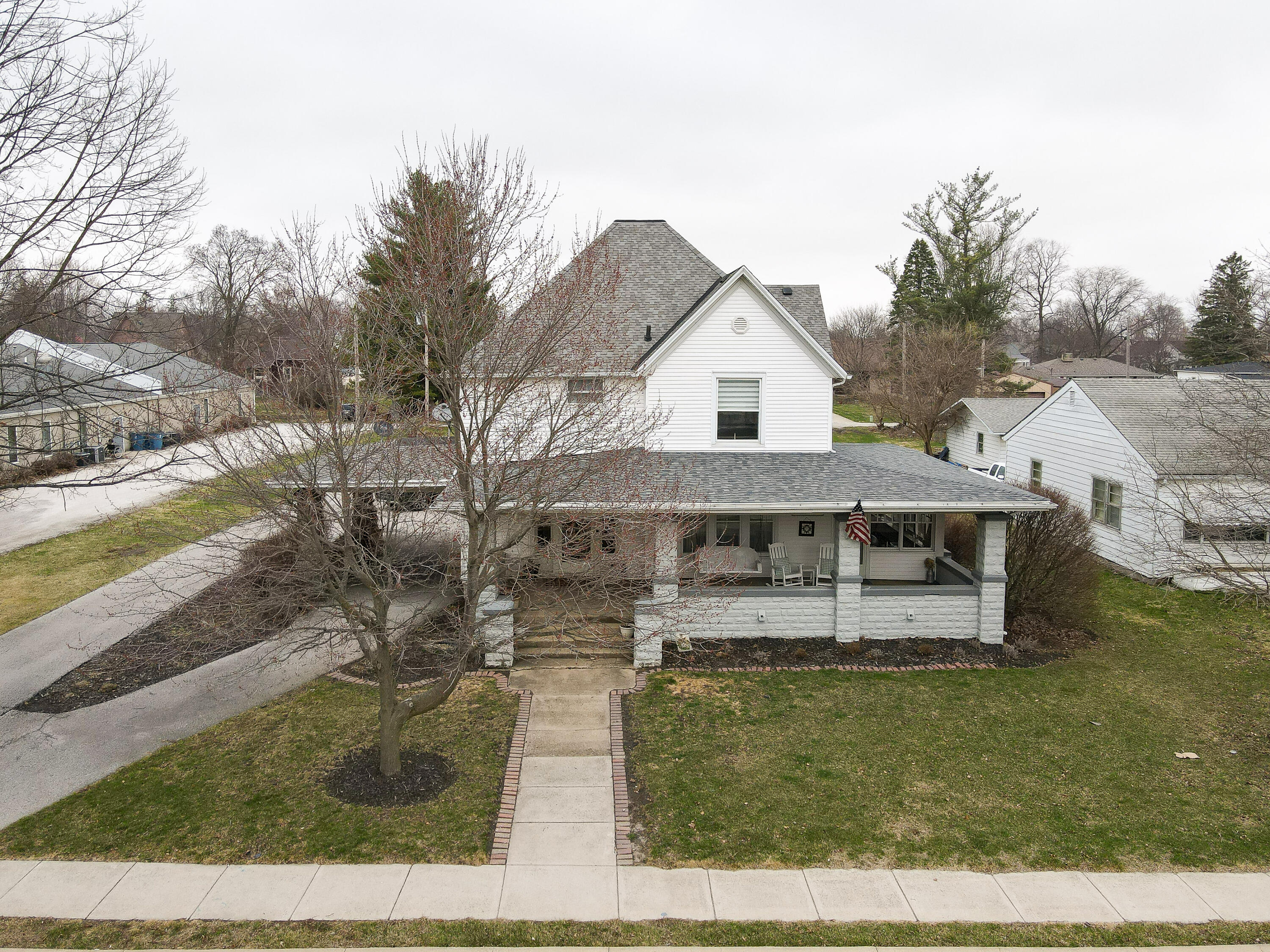 128 East Main Street Brook, IN 47922 - Photo 17 of 68 a front view of a house with garden