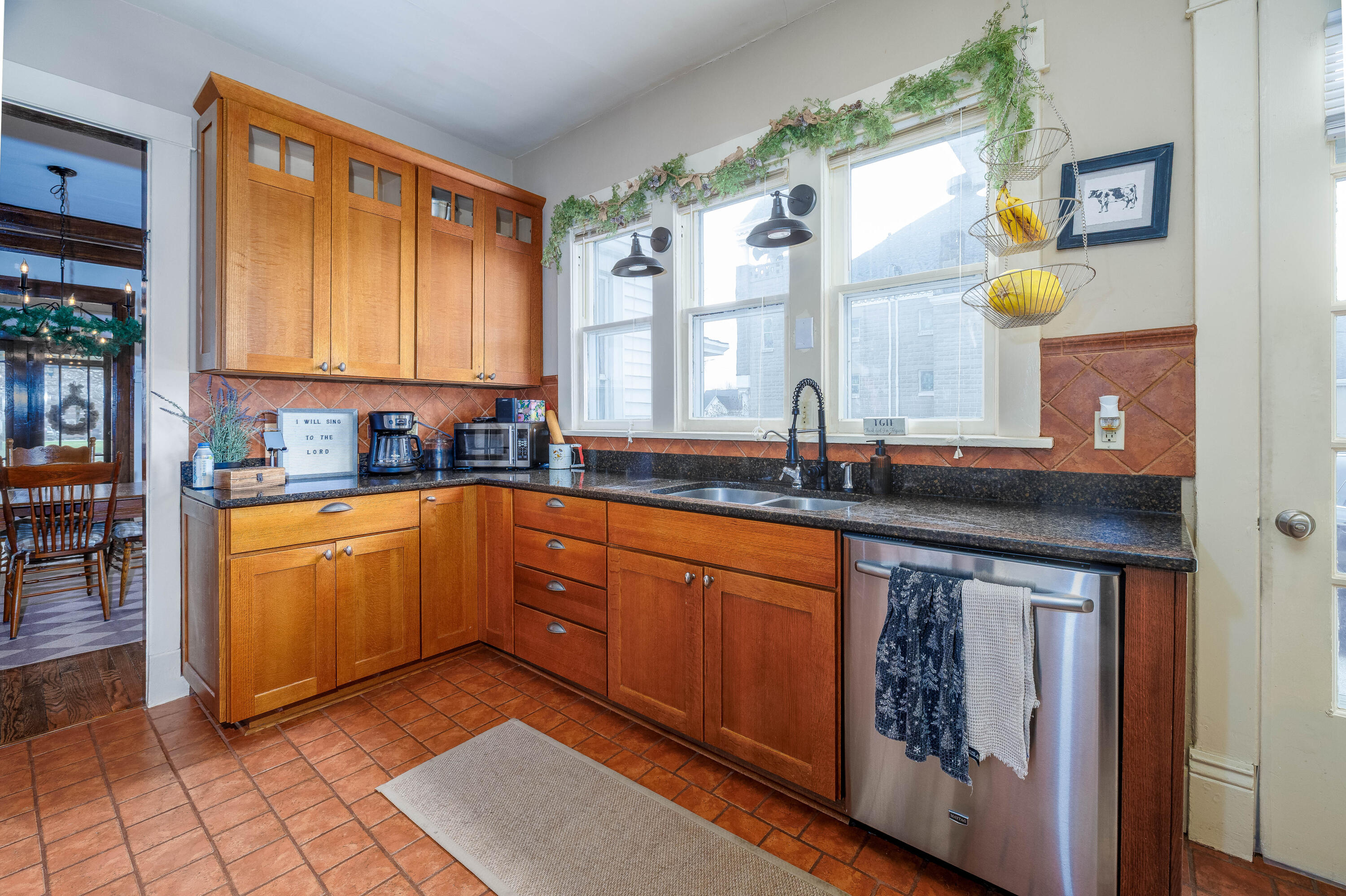 128 East Main Street Brook, IN 47922 - Photo 39 of 68 a kitchen with stainless steel appliances granite countertop a sink stove and cabinets