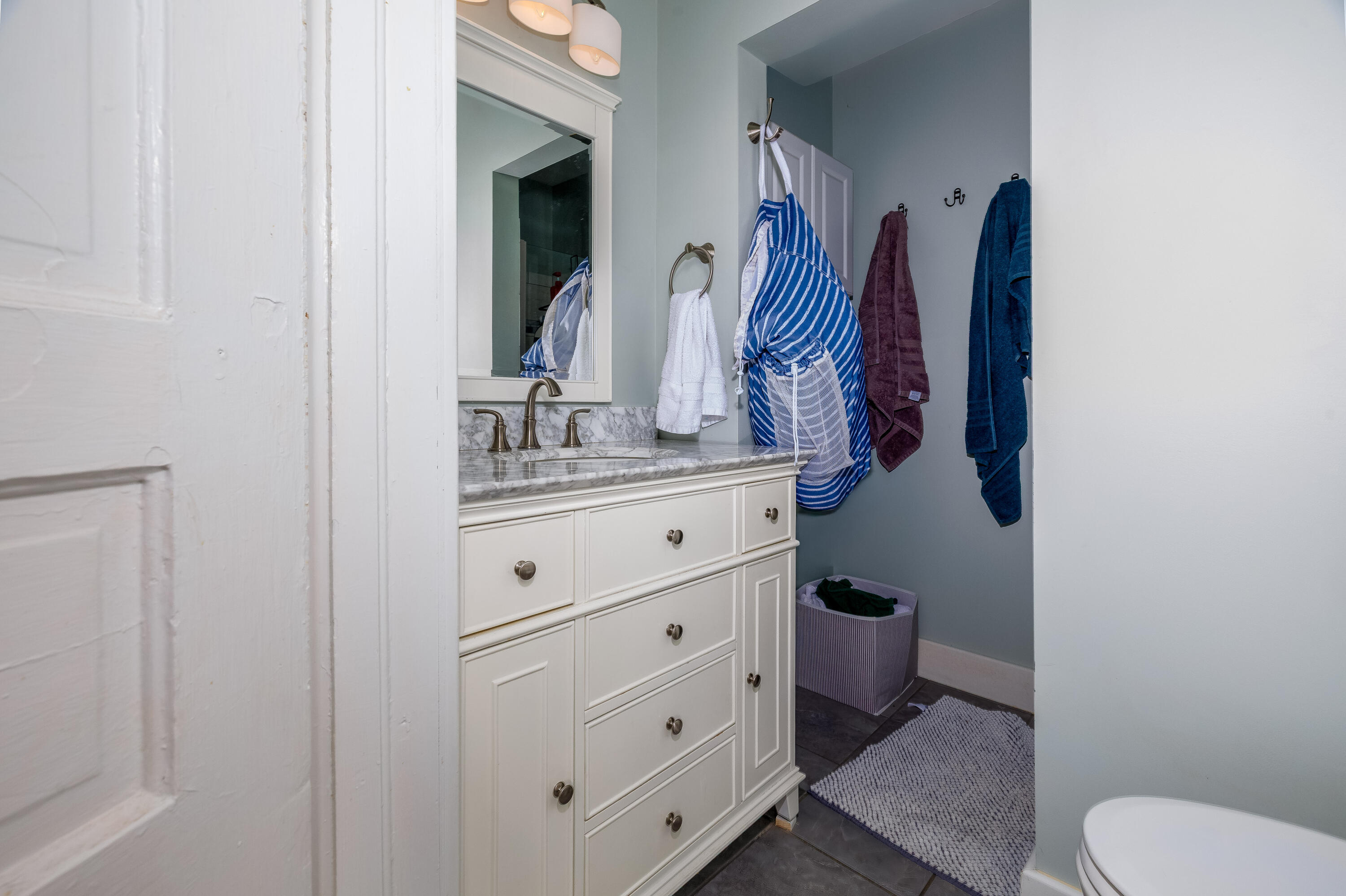 128 East Main Street Brook, IN 47922 - Photo 48 of 68 a bathroom with a toilet sink and mirror