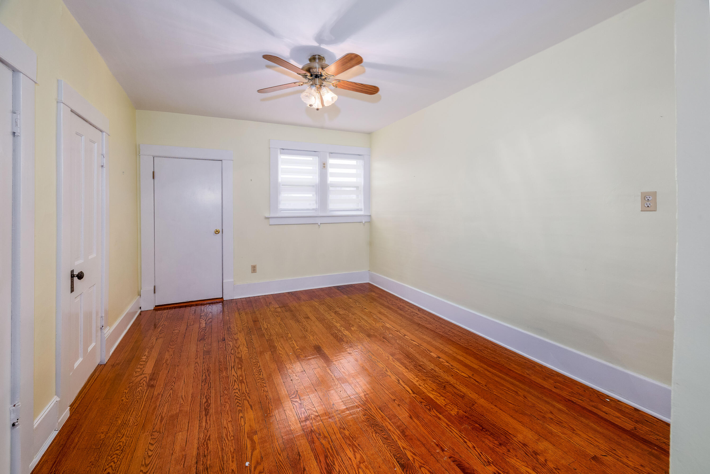 128 East Main Street Brook, IN 47922 - Photo 59 of 68 wooden floor in an empty room with a window