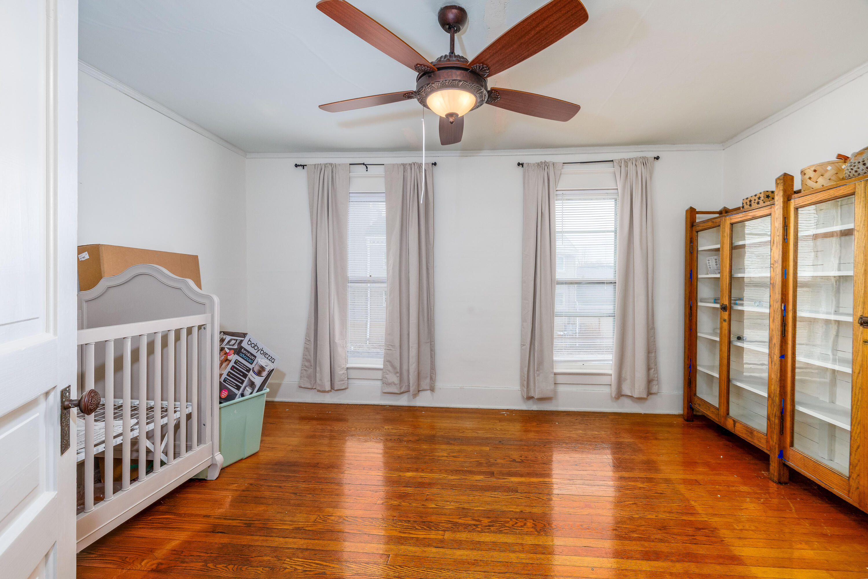 128 East Main Street Brook, IN 47922 - Photo 61 of 68 a view of an empty room with window and wooden floor