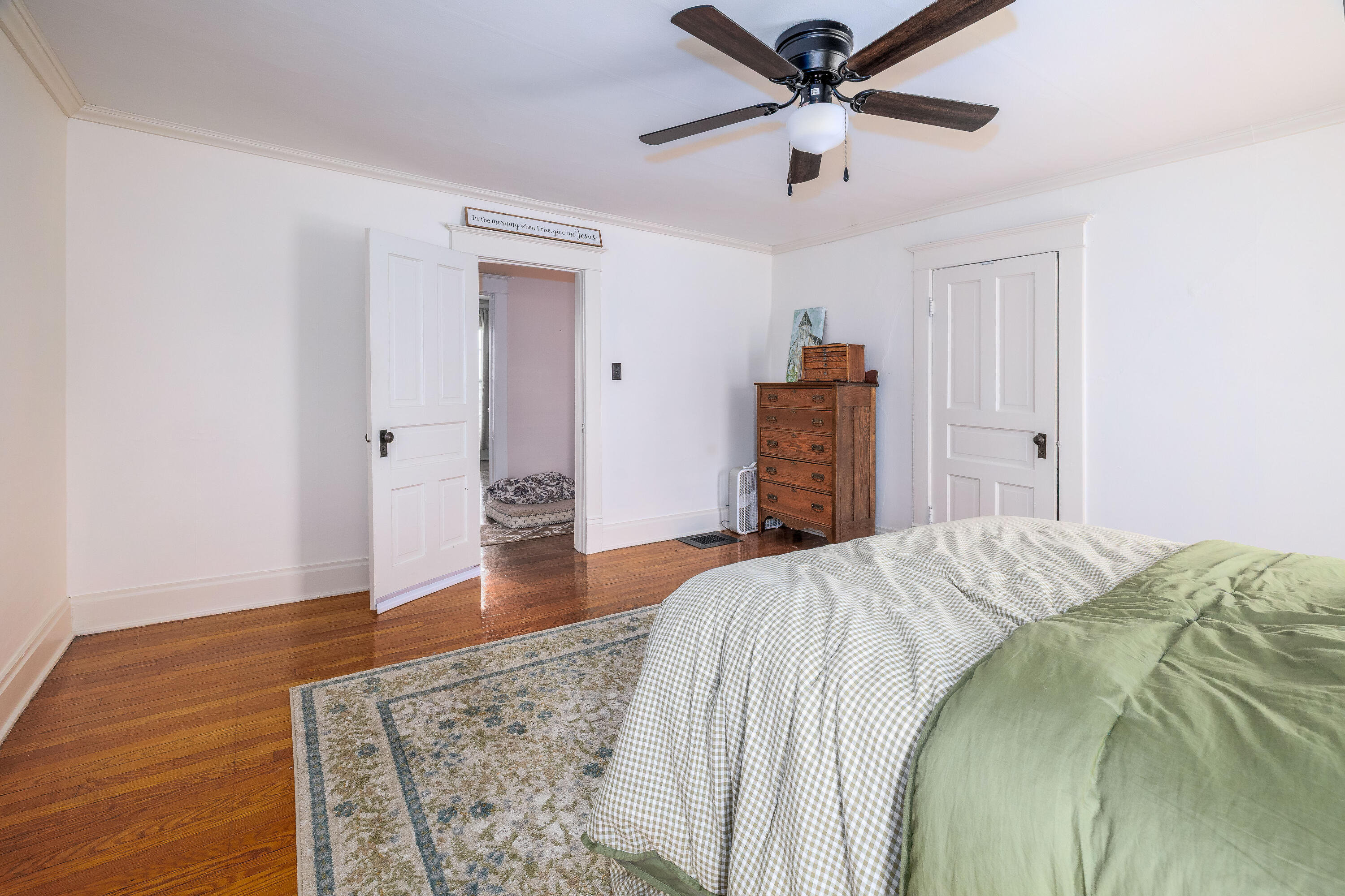 128 East Main Street Brook, IN 47922 - Photo 62 of 68 a bedroom with a bed and a ceiling fan