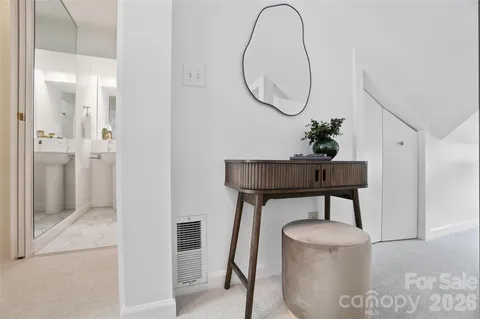 a bathroom with a shower a mirror and a sink