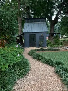 a view of a house with a yard and plants