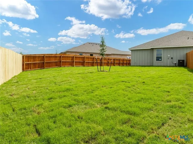 a view of a backyard of the house