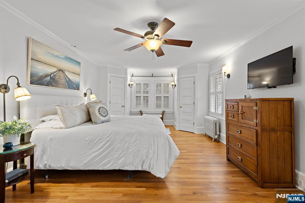 12 Midwood Road Glen Rock, NJ 07452 - Photo 12 of 30 a bedroom with a bed and a flat screen tv