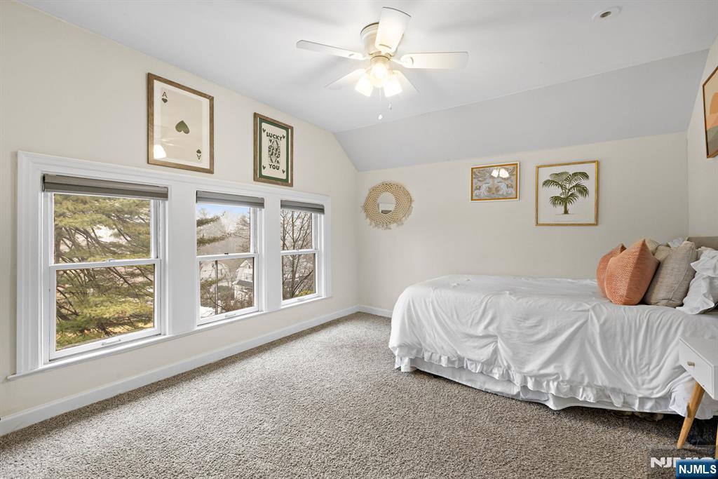 12 Midwood Road Glen Rock, NJ 07452 - Photo 18 of 30 a bedroom with a bed painting on the wall and a window