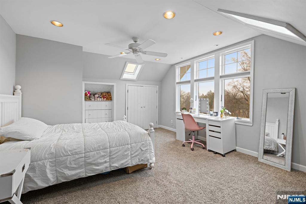 12 Midwood Road Glen Rock, NJ 07452 - Photo 20 of 30 a bedroom with a bed and a table