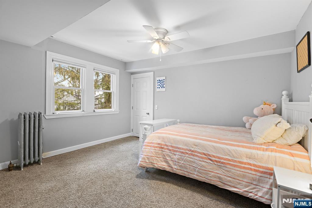 12 Midwood Road Glen Rock, NJ 07452 - Photo 21 of 30 a bedroom with a bed and window