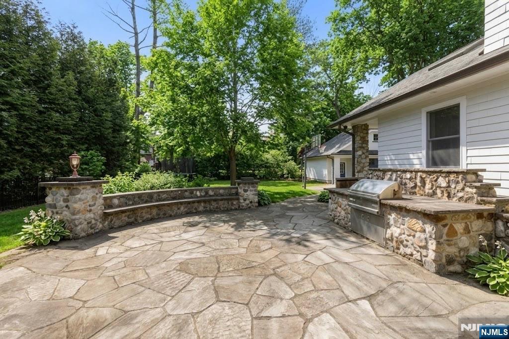 12 Midwood Road Glen Rock, NJ 07452 - Photo 26 of 30 a backyard of a house with lots of green space