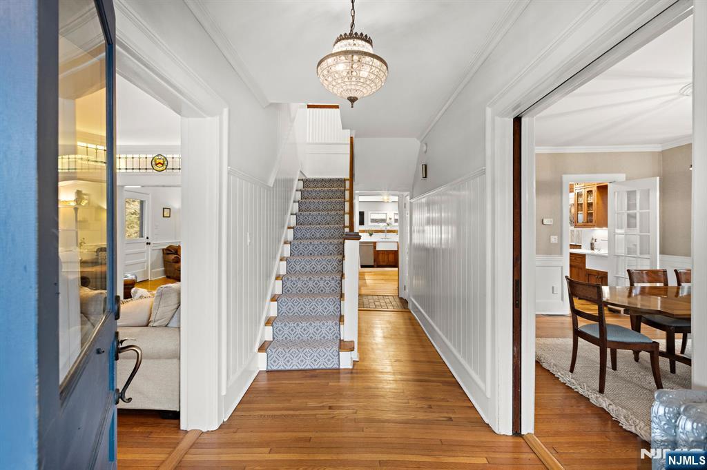 12 Midwood Road Glen Rock, NJ 07452 - Photo 3 of 30 a view of a hallway with wooden floor and staircase
