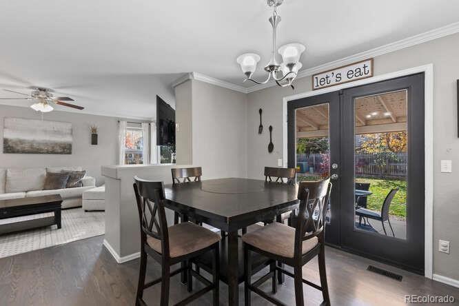 8354 Dove Ridge Way Parker, CO 80134 - Photo 11 of 38 a view of a dining room with furniture window and outside view