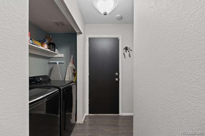 8354 Dove Ridge Way Parker, CO 80134 - Photo 15 of 38 a room that has a stove and a refrigerator