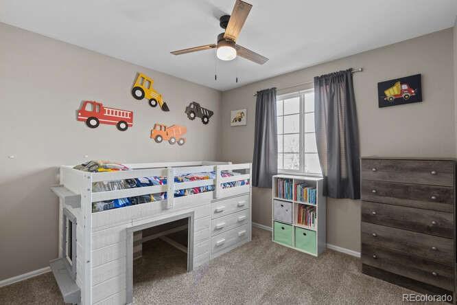 8354 Dove Ridge Way Parker, CO 80134 - Photo 27 of 38 a bedroom with a bed and a window