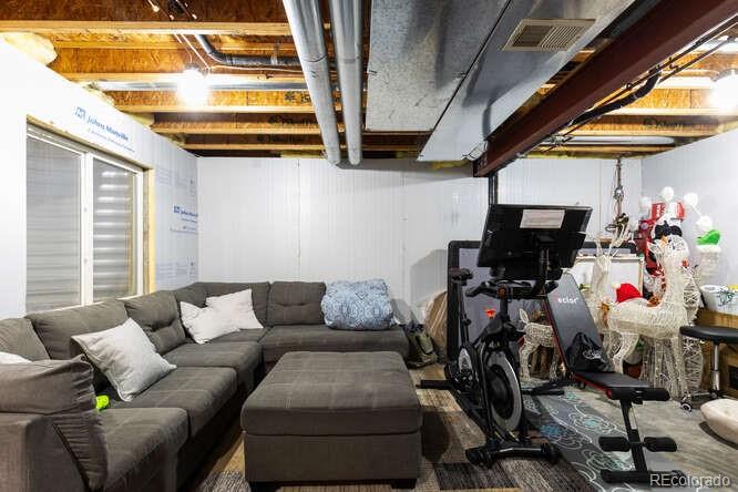8354 Dove Ridge Way Parker, CO 80134 - Photo 29 of 38 a living room with furniture and a window