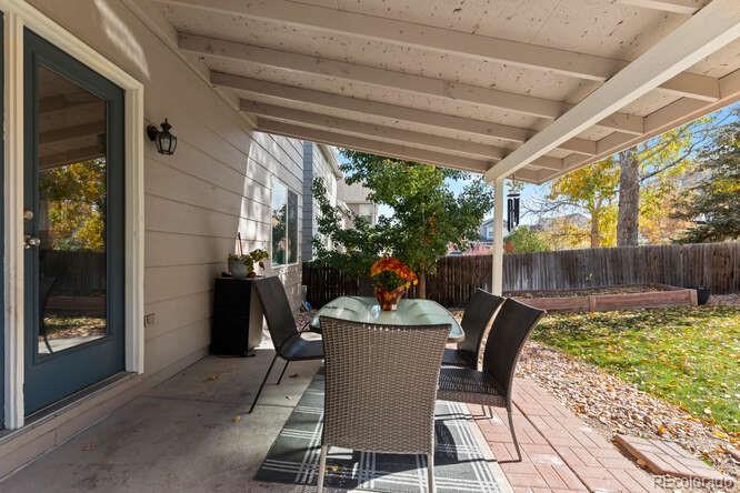 8354 Dove Ridge Way Parker, CO 80134 - Photo 32 of 38 a outdoor dining space with furniture and outdoor view