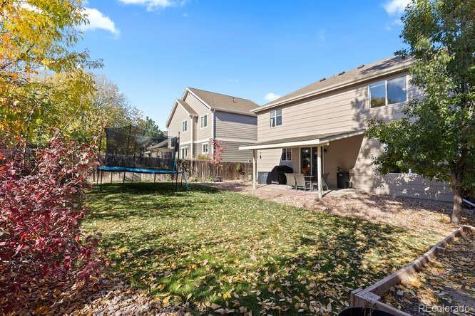 8354 Dove Ridge Way Parker, CO 80134 - Photo 35 of 38 a front view of a house with a yard