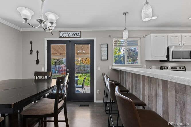 8354 Dove Ridge Way Parker, CO 80134 - Photo 10 of 38 a view of a dining room with furniture window and outside view