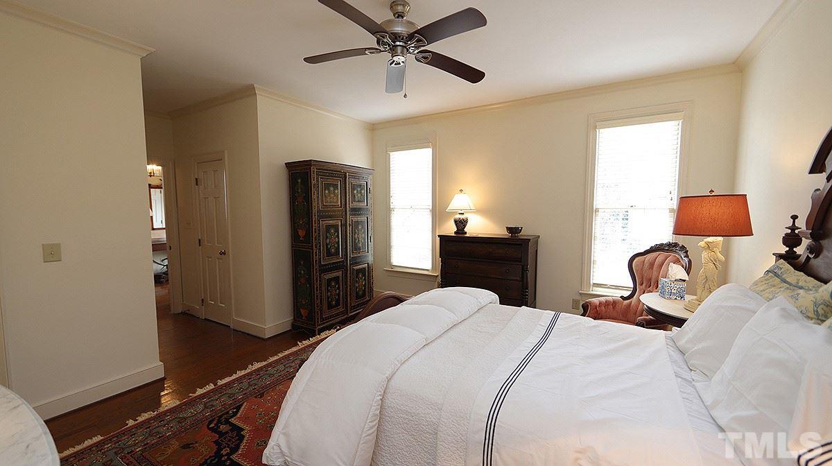 2319 Hales Road Raleigh, NC 27608 - Photo 11 of 20 a bedroom with a bed and wooden floor