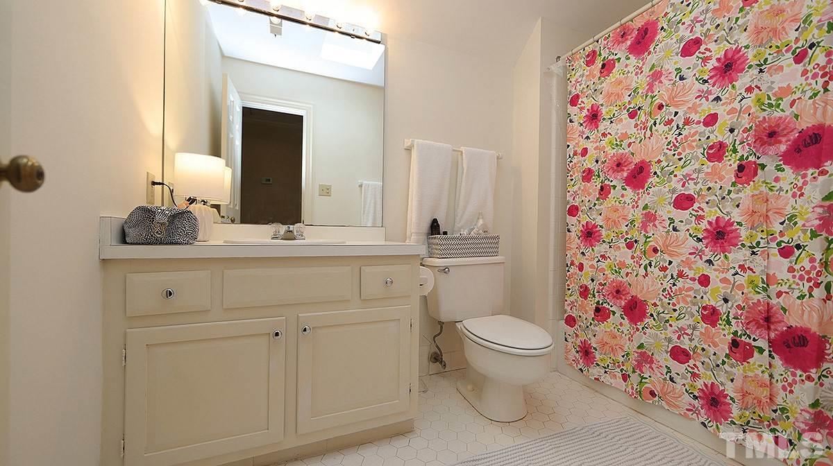 2319 Hales Road Raleigh, NC 27608 - Photo 14 of 20 a bathroom with a sink toilet and shower