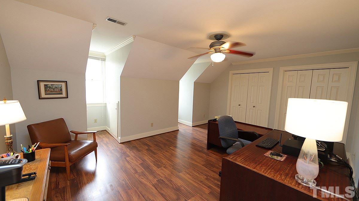 2319 Hales Road Raleigh, NC 27608 - Photo 16 of 20 a work room with furniture and wooden floor