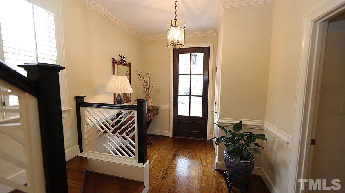 2319 Hales Road Raleigh, NC 27608 - Photo 3 of 20 a view of entryway and hall with wooden floor