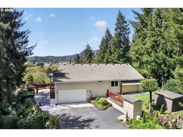an aerial view of a house with a yard basket ball court and outdoor seating