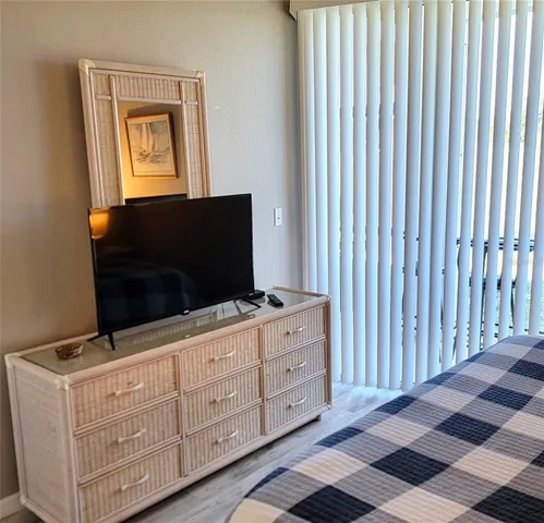 a living room with furniture and flat screen tv