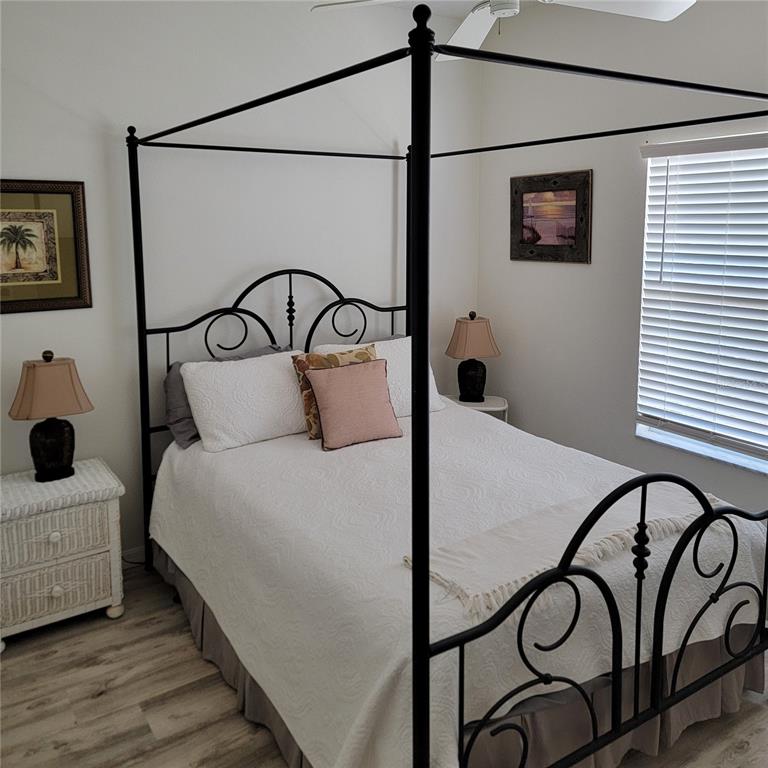 9620 Club S Circle, Unit 5105 Sarasota, FL 34238 - Photo 13 of 36 a bedroom with a bed and a window
