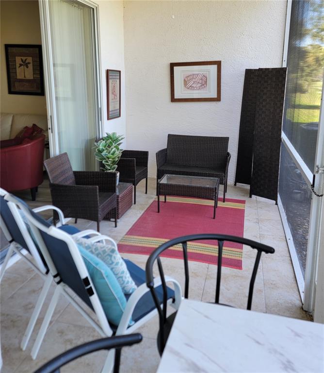 9620 Club S Circle, Unit 5105 Sarasota, FL 34238 - Photo 15 of 36 a view of a livingroom with furniture and a potted plant