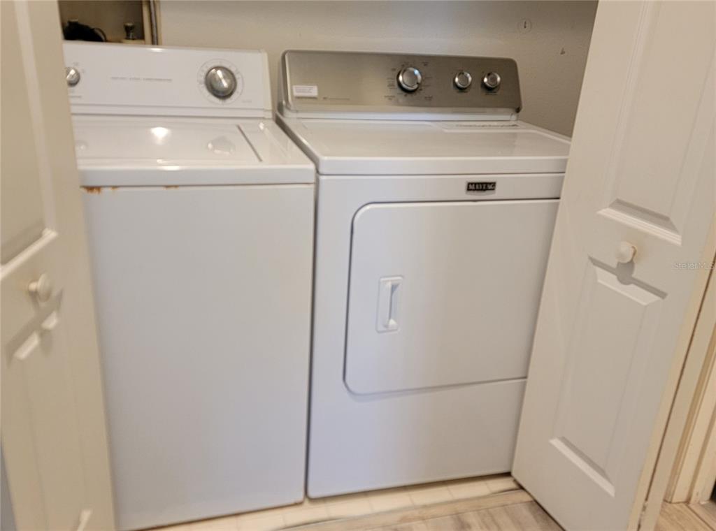 9620 Club S Circle, Unit 5105 Sarasota, FL 34238 - Photo 17 of 36 a utility room with dryer and washer
