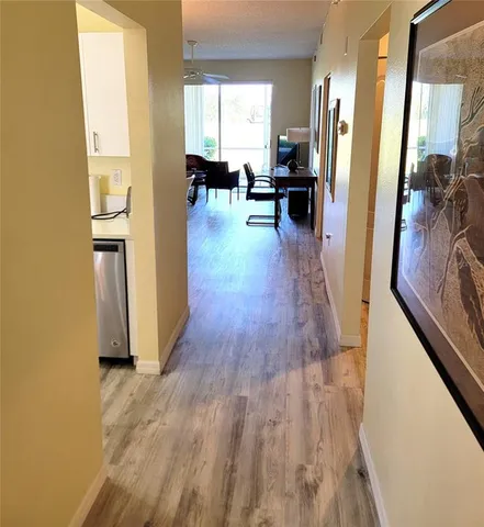 a view of a living room and hardwood floor