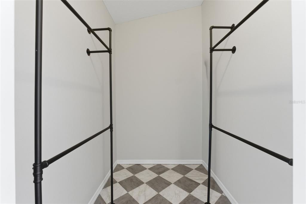 4966 Keysville Avenue Spring Hill, FL 34608 - Photo 27 of 48 a bathroom with a shower and a glass door