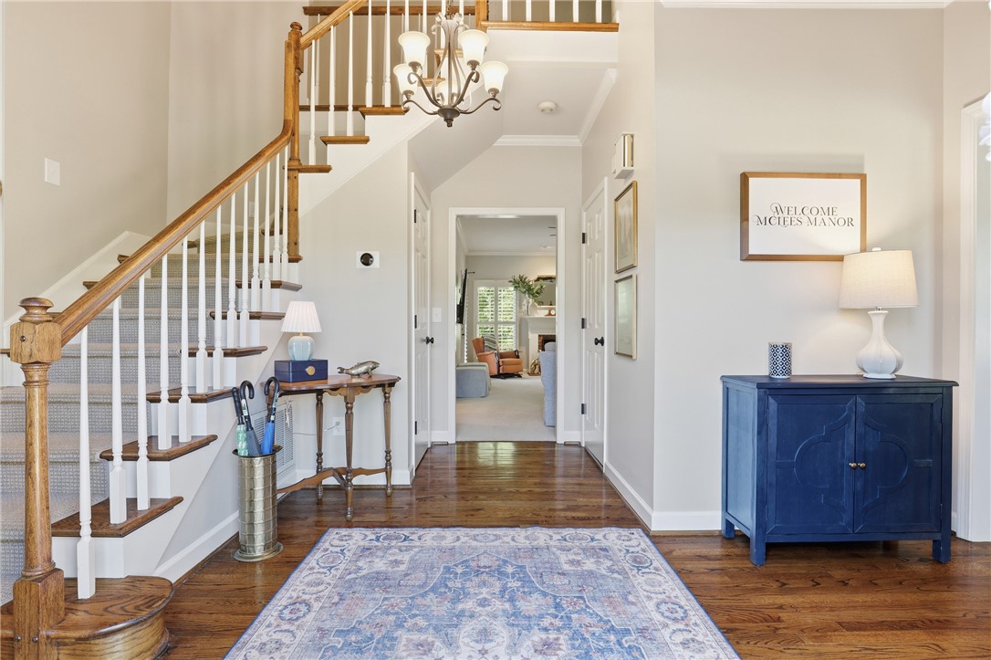 103 5 Knoll Court Anderson, SC 29621 - Photo 3 of 33 A graceful staircase with richly toned wood and crisp white balusters anchors this inviting entry.