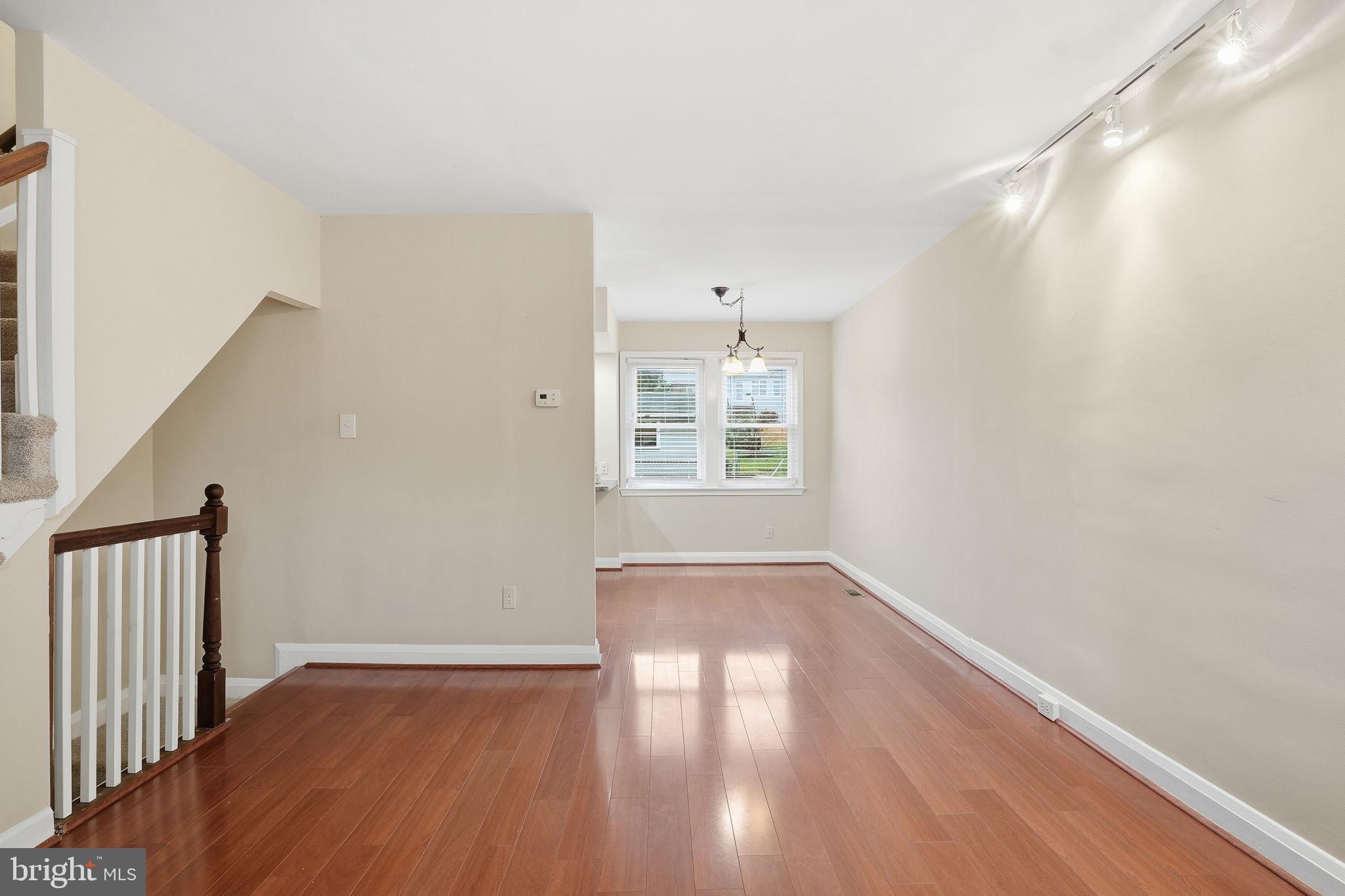 4306 Newport Avenue Baltimore, MD 21211 - Photo 14 of 44 a view of an empty room with wooden floor and a window