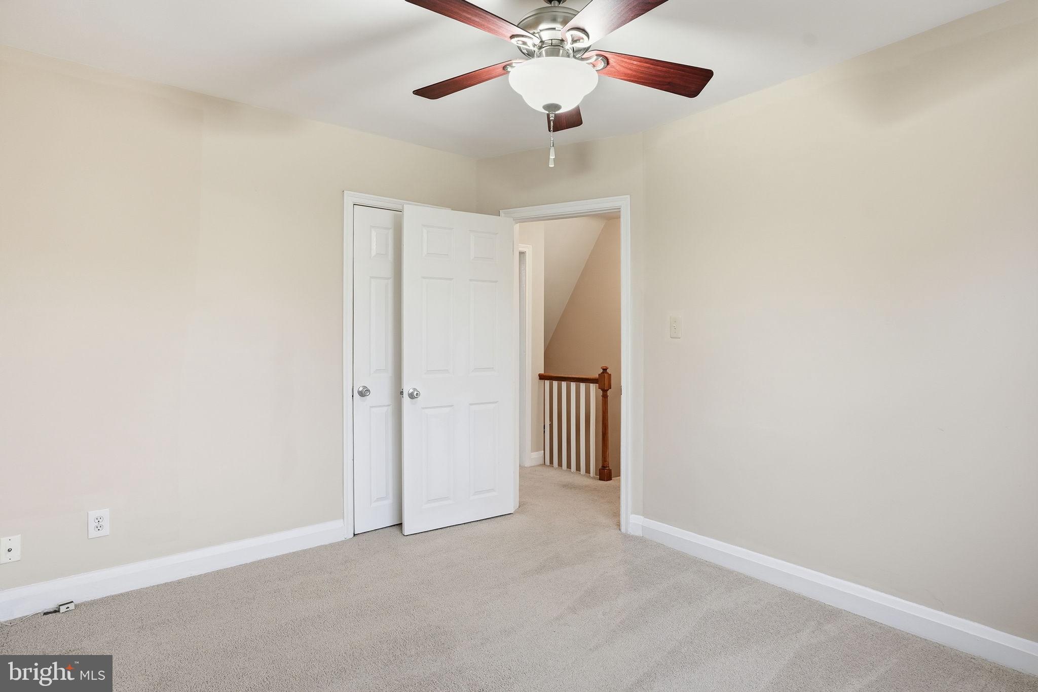 4306 Newport Avenue Baltimore, MD 21211 - Photo 24 of 44 an empty room and chandelier fan