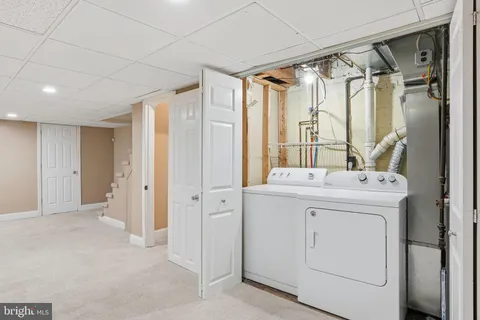 a view of an empty room with stairs